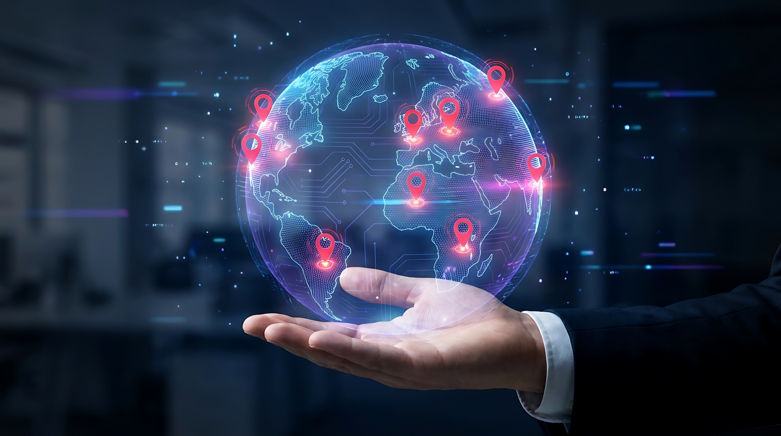Businessperson’s open hand holding a glowing digital globe with red location pins marking sites across several continents.